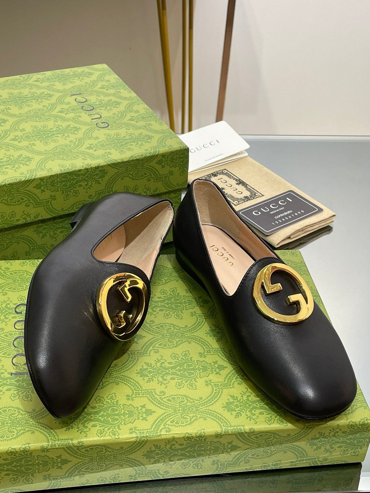BLONDIE LOGO-PLAQUE LOAFERS IN BLACK CALFSKIN WITH GOLD HARDWARE