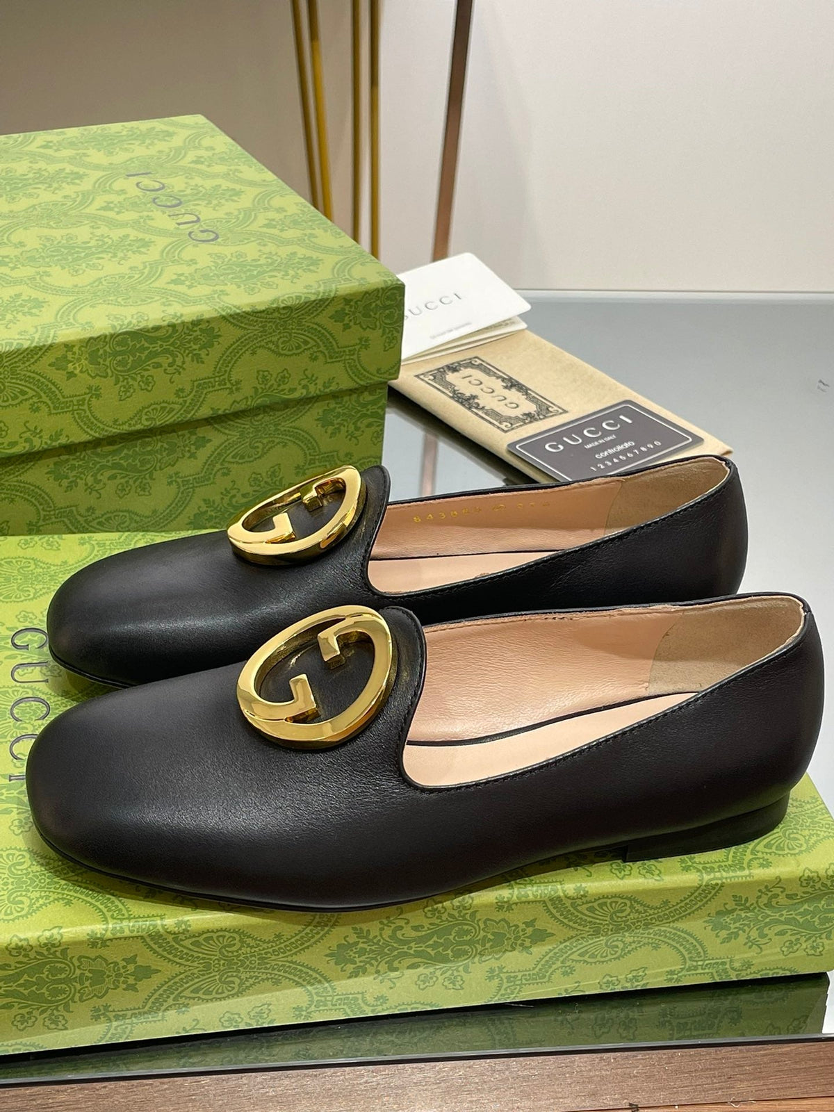 BLONDIE LOGO-PLAQUE LOAFERS IN BLACK CALFSKIN WITH GOLD HARDWARE