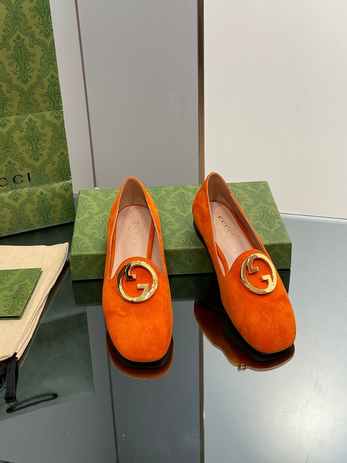 BLONDIE LOGO-PLAQUE LOAFERS IN TIGER ORANGE SUEDE WITH GOLD HARDWARE