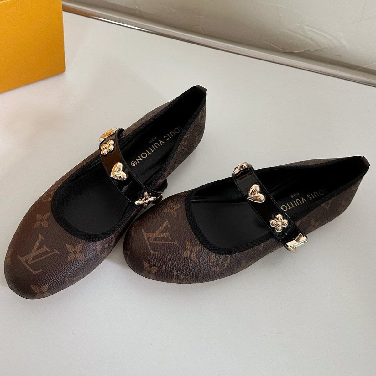ROMY FLAT BALLERINA IN CHOCOLATE BROWN MONOGRAM CALFSKIN