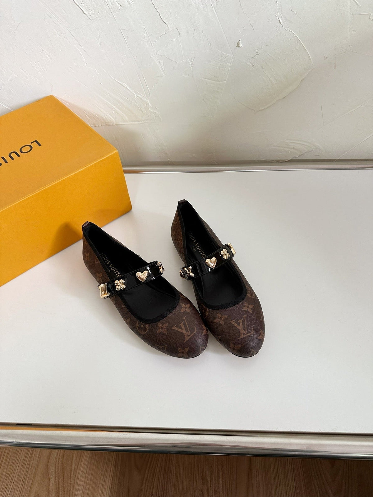 ROMY FLAT BALLERINA IN CHOCOLATE BROWN MONOGRAM CALFSKIN