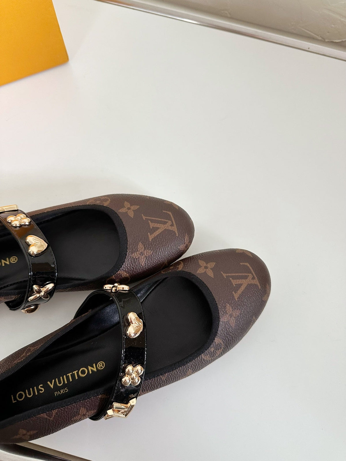 ROMY FLAT BALLERINA IN CHOCOLATE BROWN MONOGRAM CALFSKIN