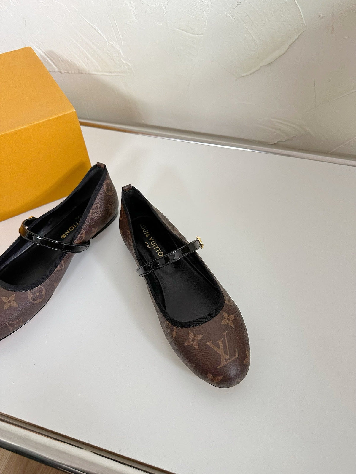 ROMY FLAT BALLERINA IN BROWN MONOGRAM CALFSKIN