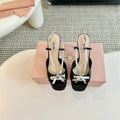 Black High Heels With Silver Bow