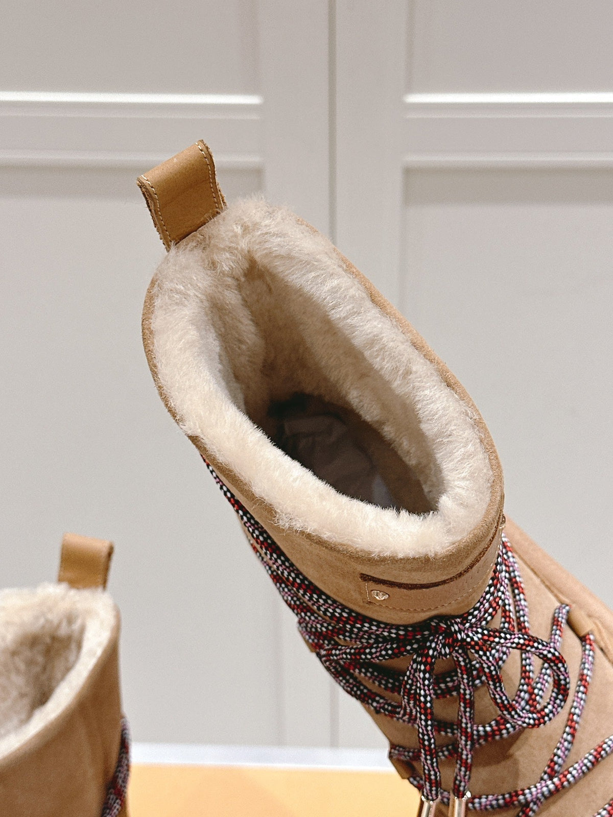 ASPEN PLATFORM ANKLE BOOT IN CIDER BROWN MONOGRAM DEBOSSED SUEDE AND SHEARLING