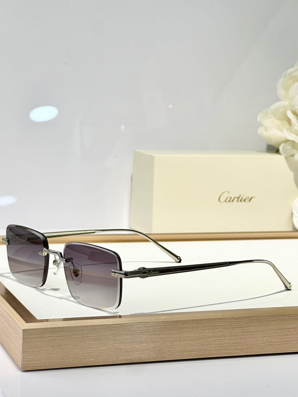 C DE RIMLESS SQUARE FRAME SUNGLASSES CT0610S IN METAL