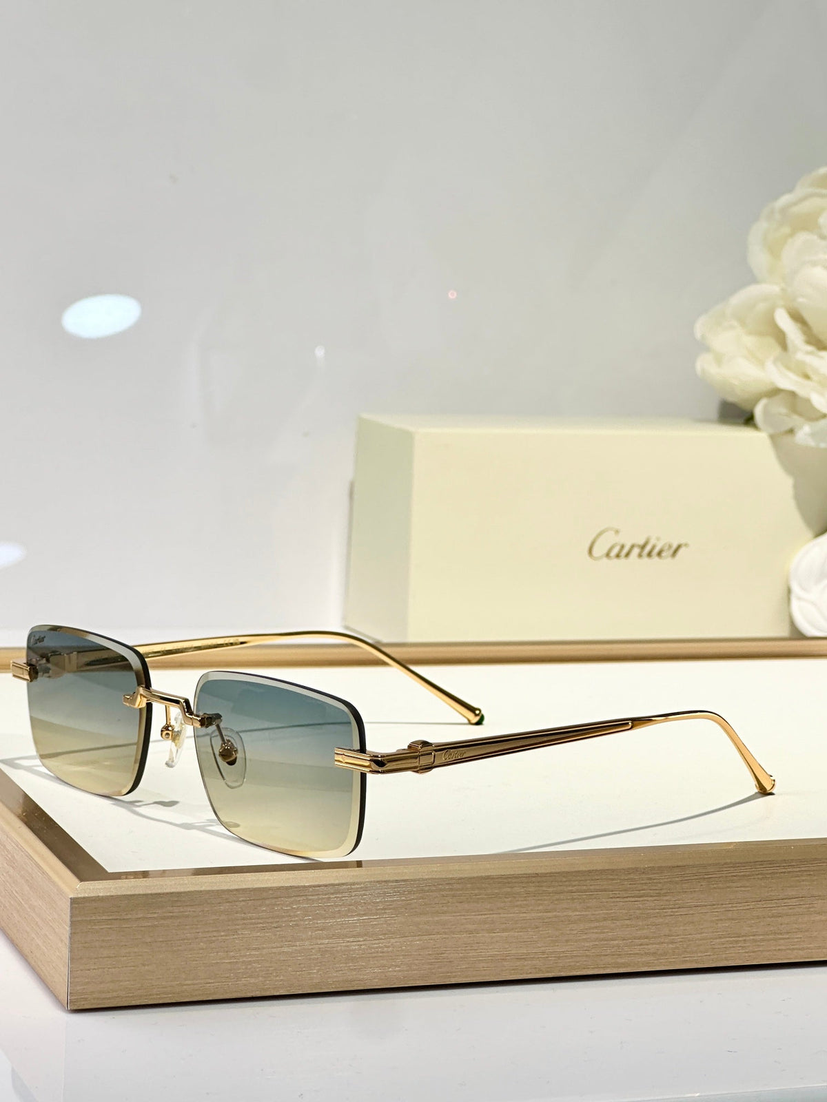 C DE RIMLESS SQUARE FRAME SUNGLASSES CT0610S IN METAL