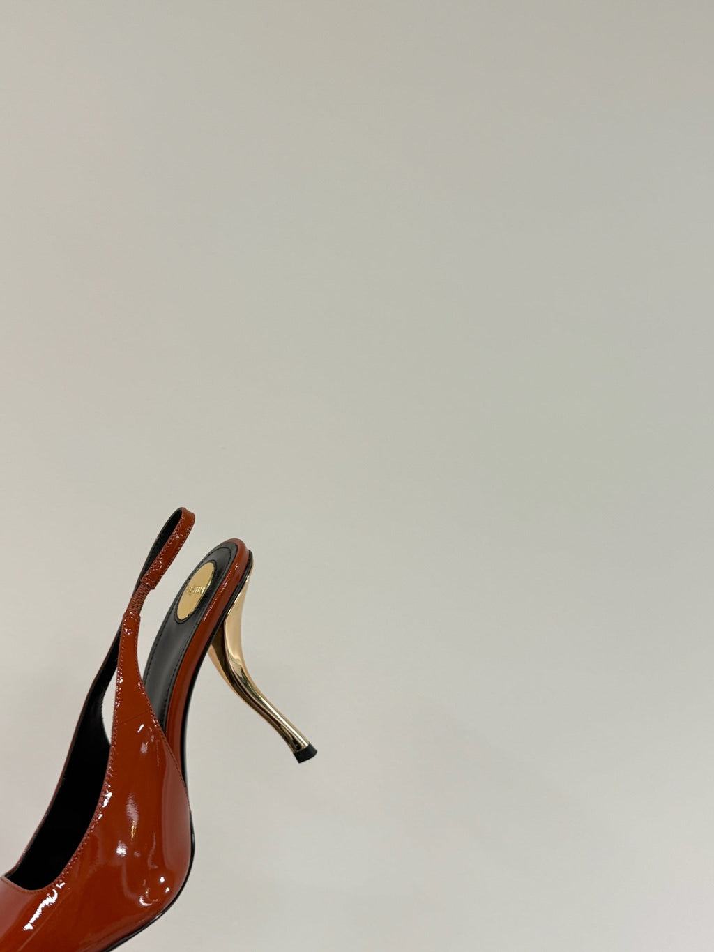 RED GEM-STUDDED SLINGBACK PUMPS IN ORANGE PATENT CALFSKIN