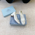 BALLERINA PUMPS WITH TRIANGLE LOGO AND BOW IN WHITE CALFSKIN