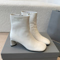 ANKLE BOOTS IN WHITE LOGO EMBOSSED SOFT SHEEPSKIN