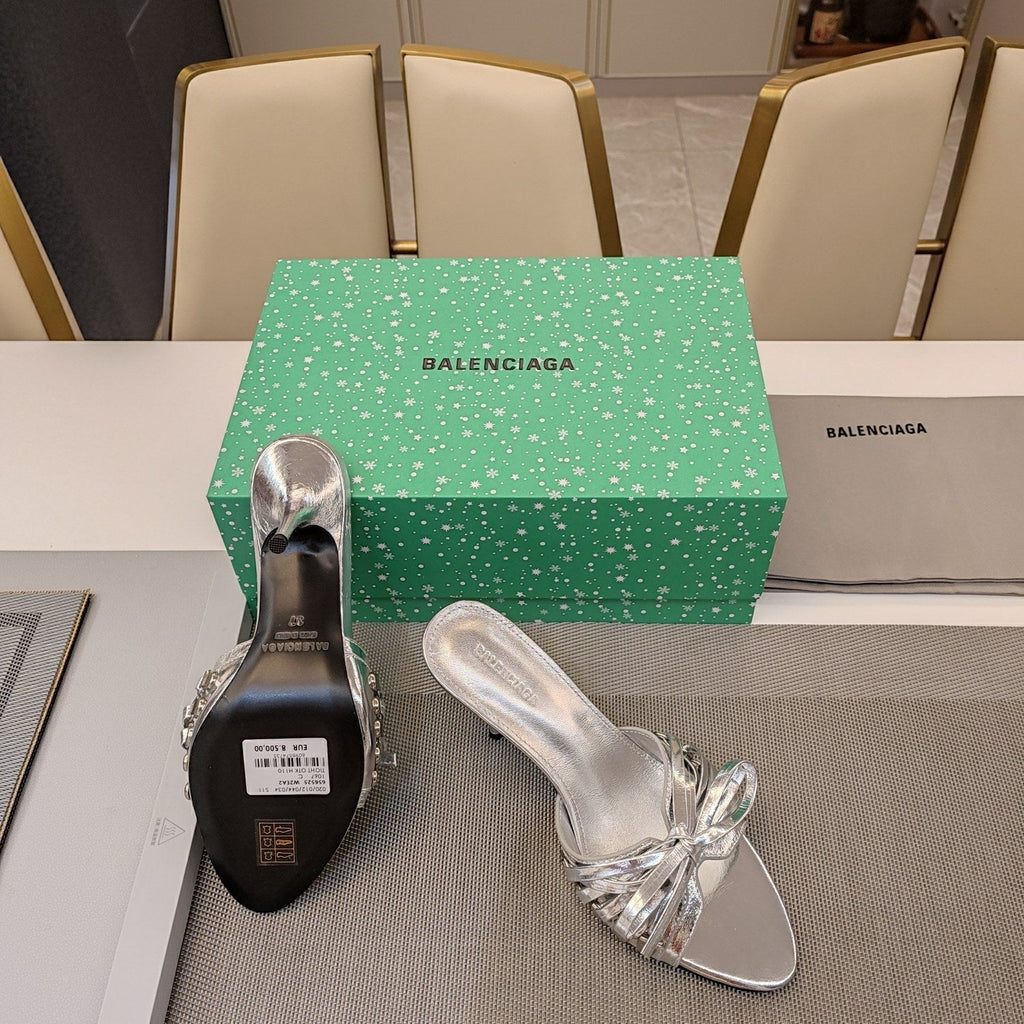 BOW-EMBELLISHED HIGH MULES IN SILVER METALLIC SHEEPSKIN